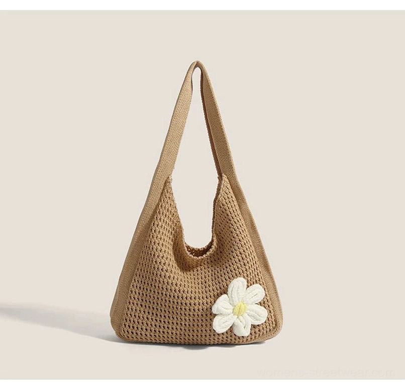 Khaki crochet hobo shoulder bag with white 3d daisy accent, open-knit texture, and relaxed slouchy silhouette