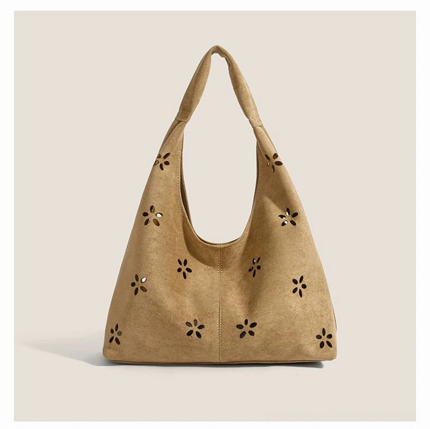 Khaki daisy cutout suede-effect hobo tote bag with wide shoulder strap front studio view