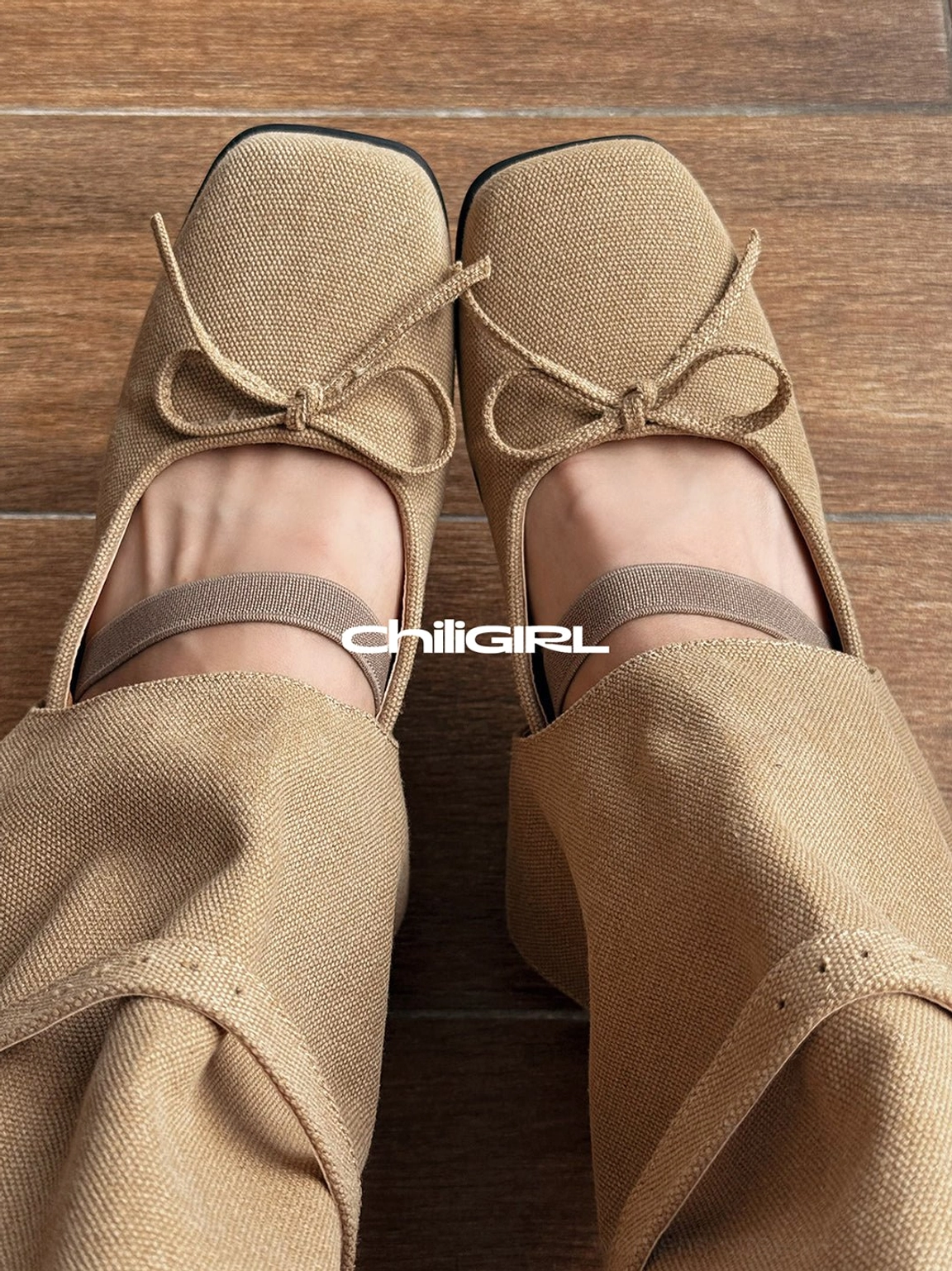 Close-up top view of khaki denim Mary Jane boots showing square toe, bow decoration and folded shaft