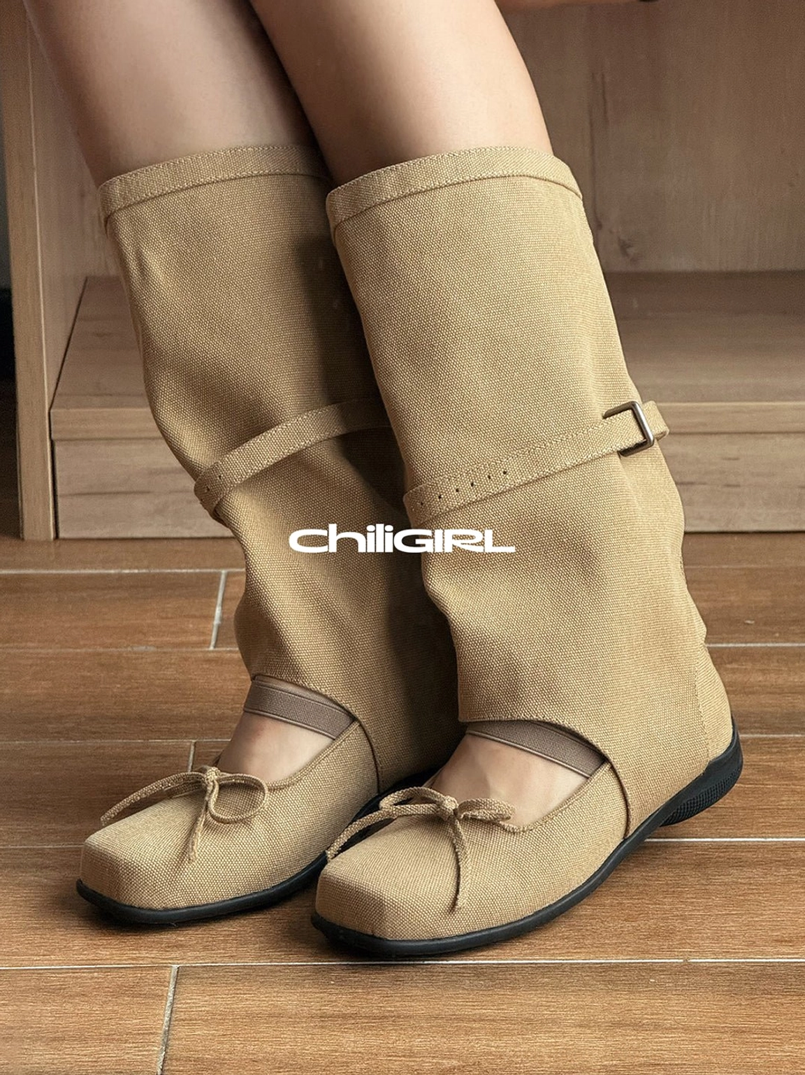 Model wearing khaki denim Mary Jane boots with folded mid-calf shaft and flat sole in a streetwear outfit