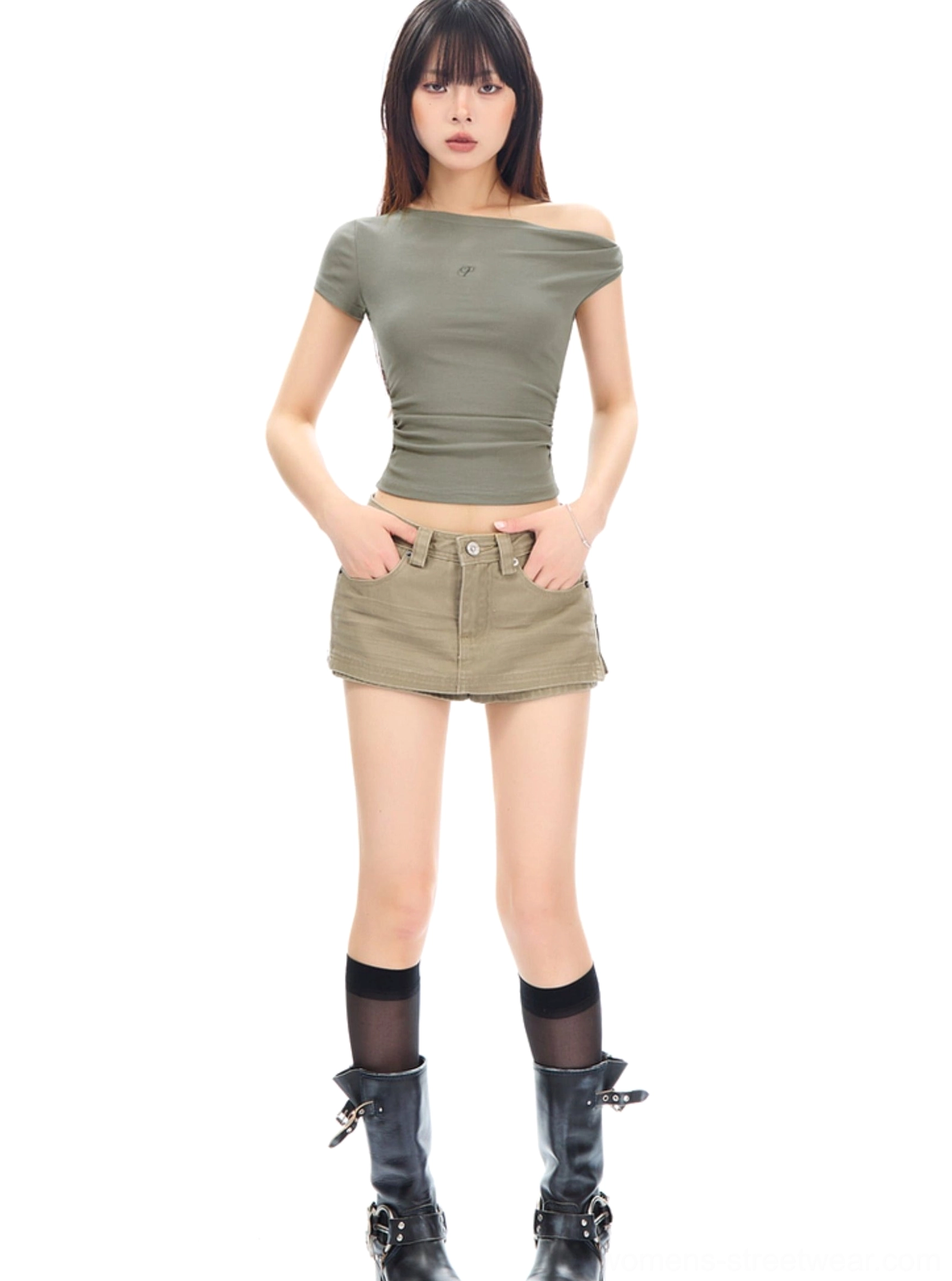 Khaki denim mini skirt paired with an off-shoulder sage green top in a clean Seoul streetwear studio outfit