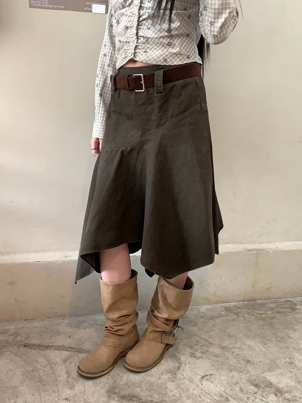 Khaki green asymmetric panel cotton midi skirt back view showing the irregular patchwork hem and high-waist fit
