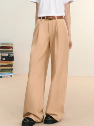 Khaki high-waist pleated wide-leg streetwear trousers shown in a full-body front view with a white T-shirt and brown leather belt