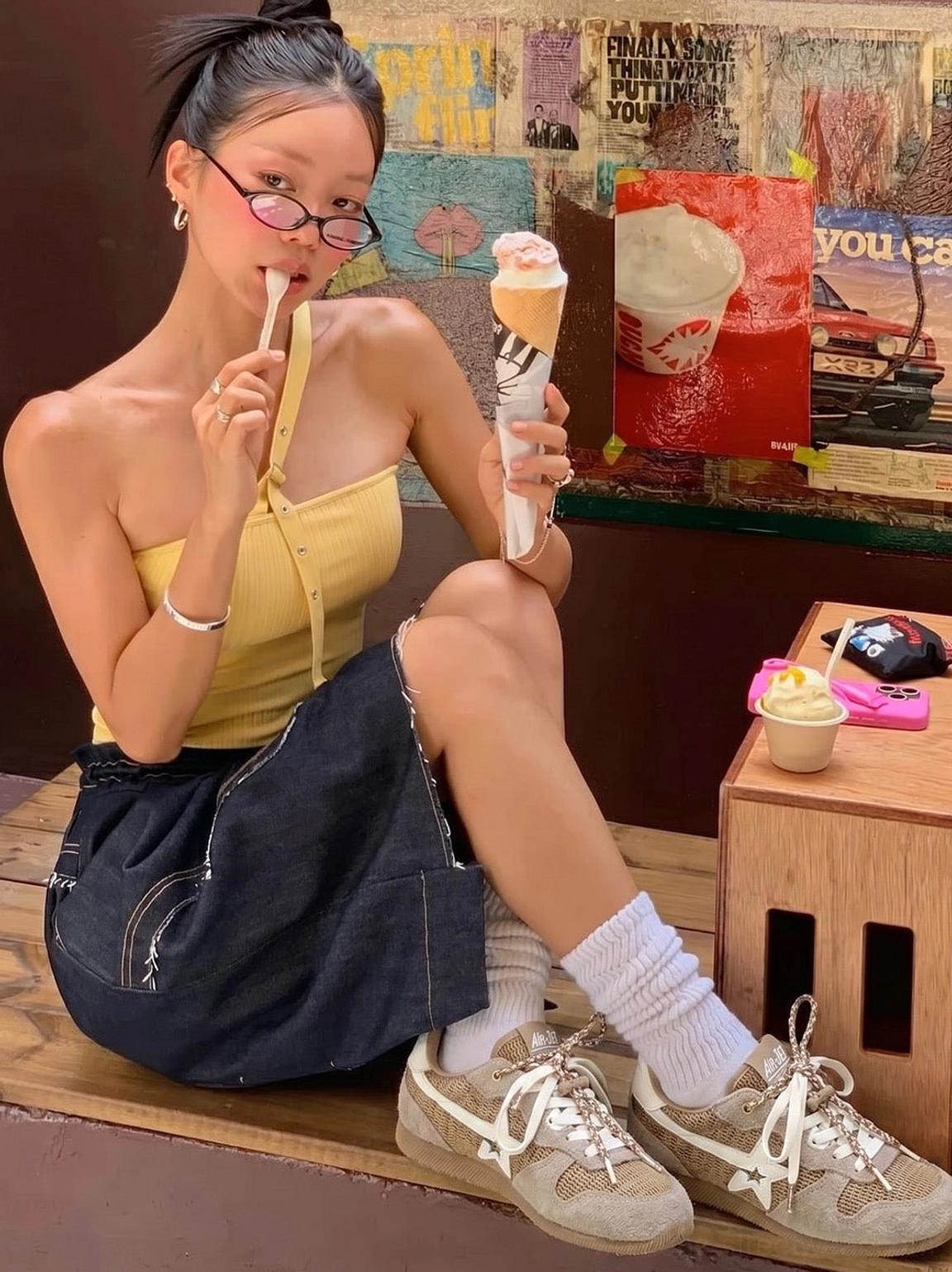 Female model wearing khaki mesh star German trainer sneakers with white crew socks in a casual street cafe outfit
