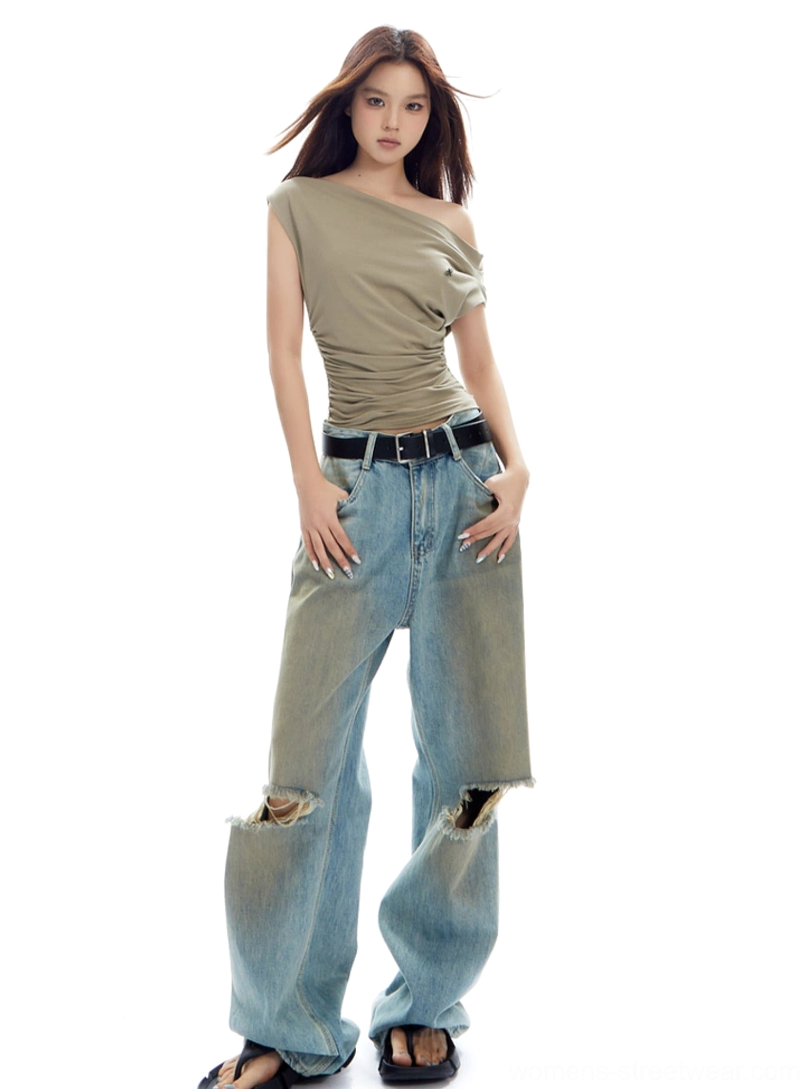Three-quarter view of khaki asymmetrical off-shoulder top with draped sleeve and figure-flattering ruching