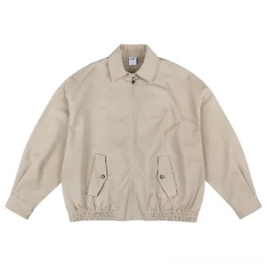 Khaki oversized cotton work jacket with front zipper pointed collar flap pockets and relaxed streetwear silhouette
