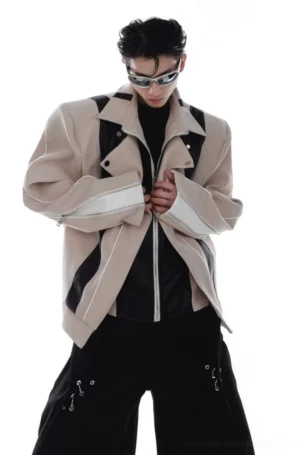 Khaki oversized layered PU leather biker jacket shown from the front three-quarter angle with contrast panels, silver zippers, structured shoulders, and zippered cuffs