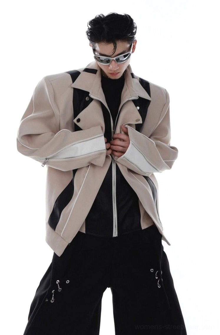 Khaki oversized layered PU leather biker jacket shown from the front three-quarter angle with contrast panels, silver zippers, structured shoulders, and zippered cuffs