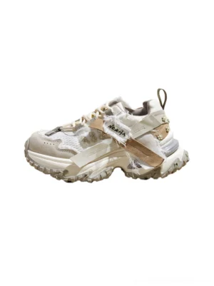 Khaki and cream patchwork mesh platform trail sneakers for women shown in a left three-quarter product view with frayed textile panels and rugged lug outsole