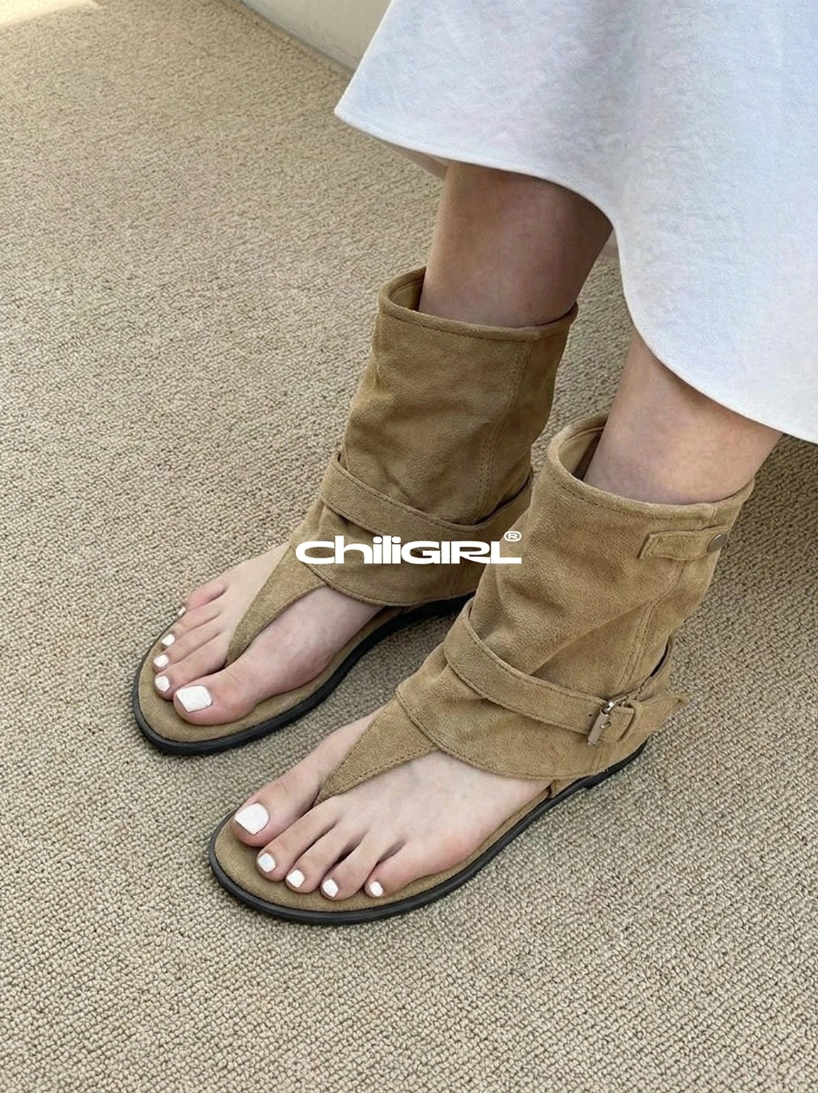 Close side view of khaki suede open toe slouchy ankle sandal boots with buckle strap