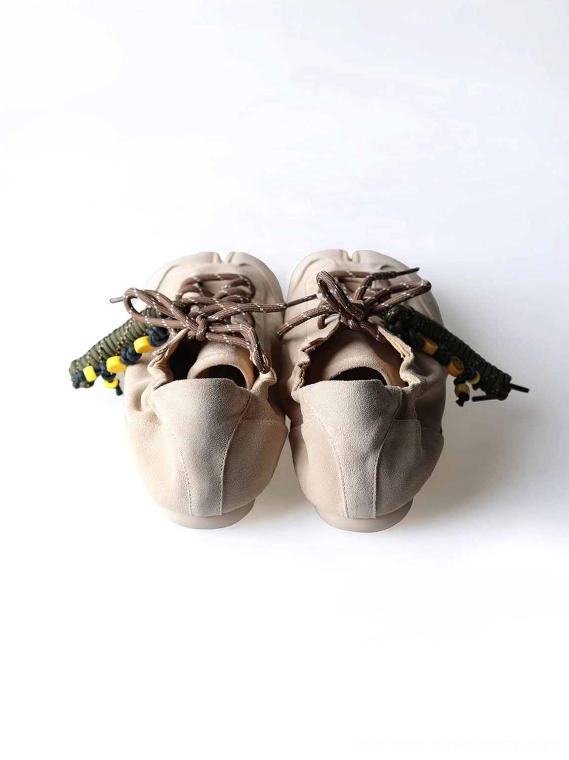 Front top view of khaki suede tabi sneakers highlighting the divided split toe and beaded shoelaces