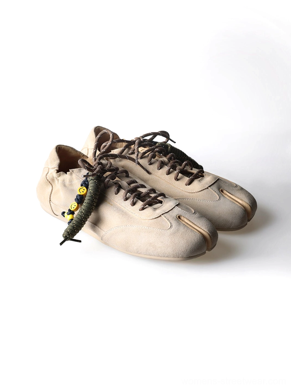 Khaki suede thin-sole tabi shoes with matte finish, elasticated heel opening, and black yellow bead accents