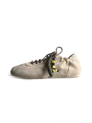 Khaki suede thin-sole tabi sneakers with split toe, beaded laces, and low-profile flat sole side view