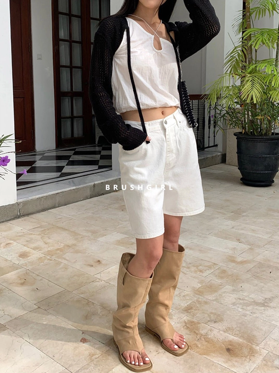 Back view of khaki western thong knee-high sandal boots showing the relaxed shaft and rear silhouette