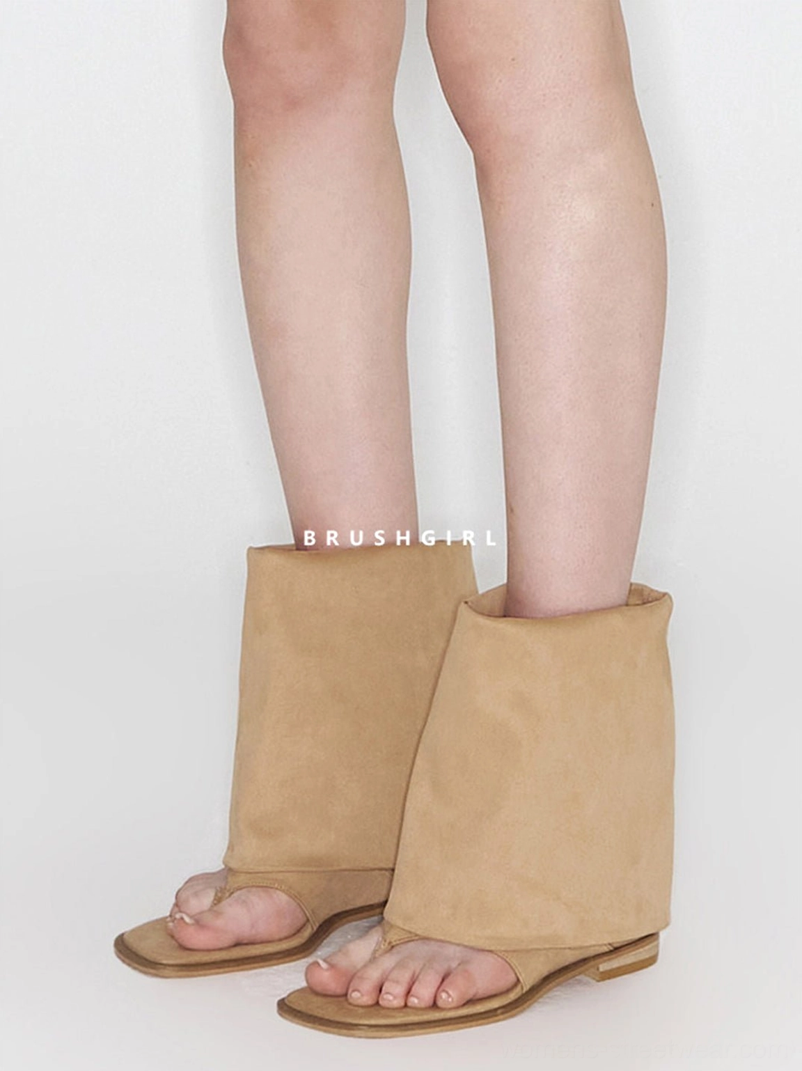 Side view of khaki western sandal boots showing the open thong toe, rolled shaft, and flat sandal sole