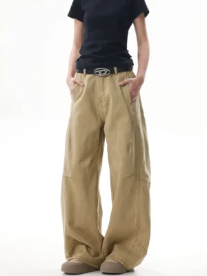 Front view of relaxed khaki wide-leg casual streetwear pants with zipper fly, structured vertical seams, roomy pockets, and high-waisted fit