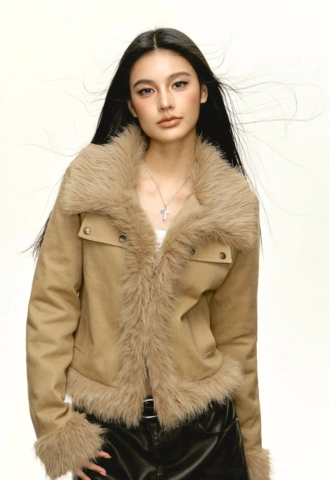 Close-up front view of khaki Y2K faux fur trim cropped jacket styled with black leather pants