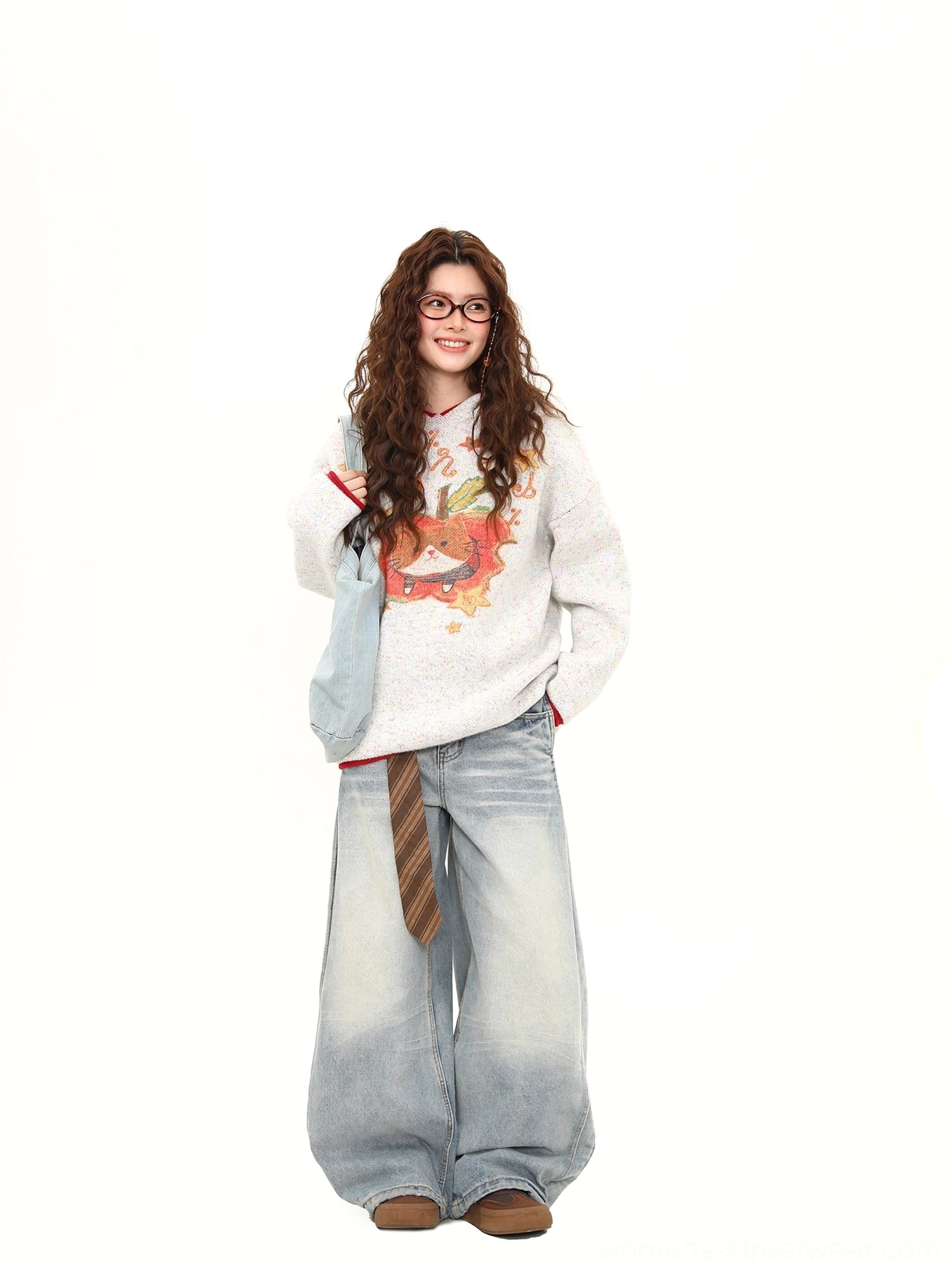 Close front studio view of white gray cat apple graphic oversized knit sweater with contrast red neckline and hem