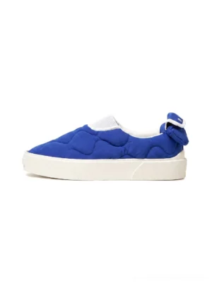 Klein blue quilted slip-on skate shoes with white platform rubber sole and heel bow detail side view