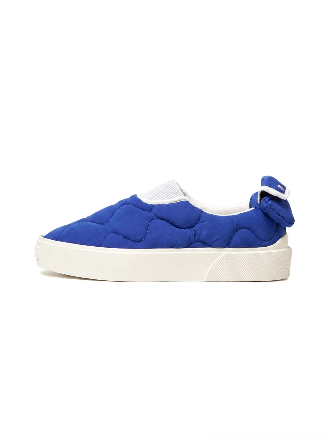 Klein blue quilted slip-on skate shoes with white platform rubber sole and heel bow detail side view