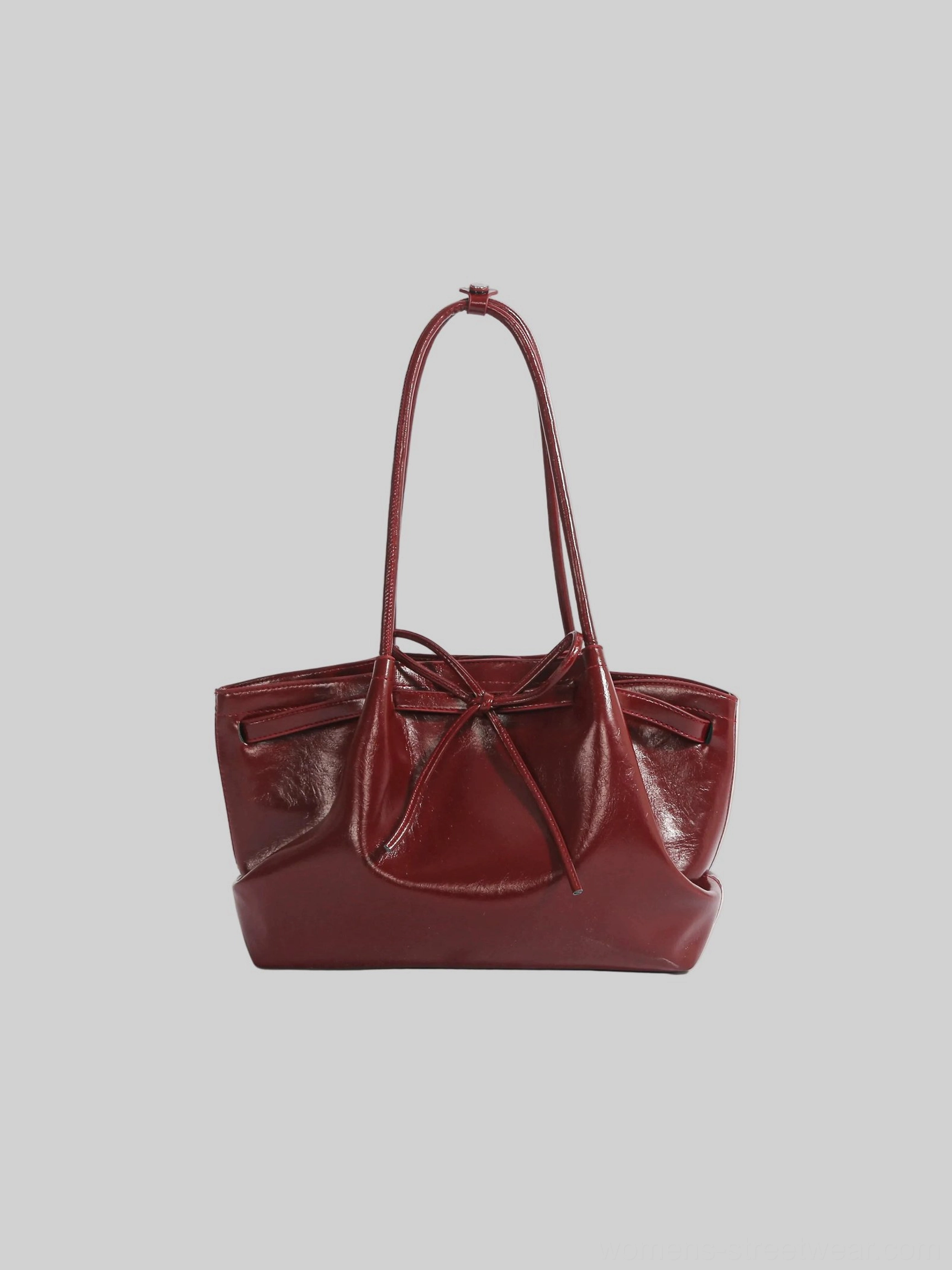 Burgundy red Korean bow cinch shoulder tote bag in smooth glossy PU leather studio view