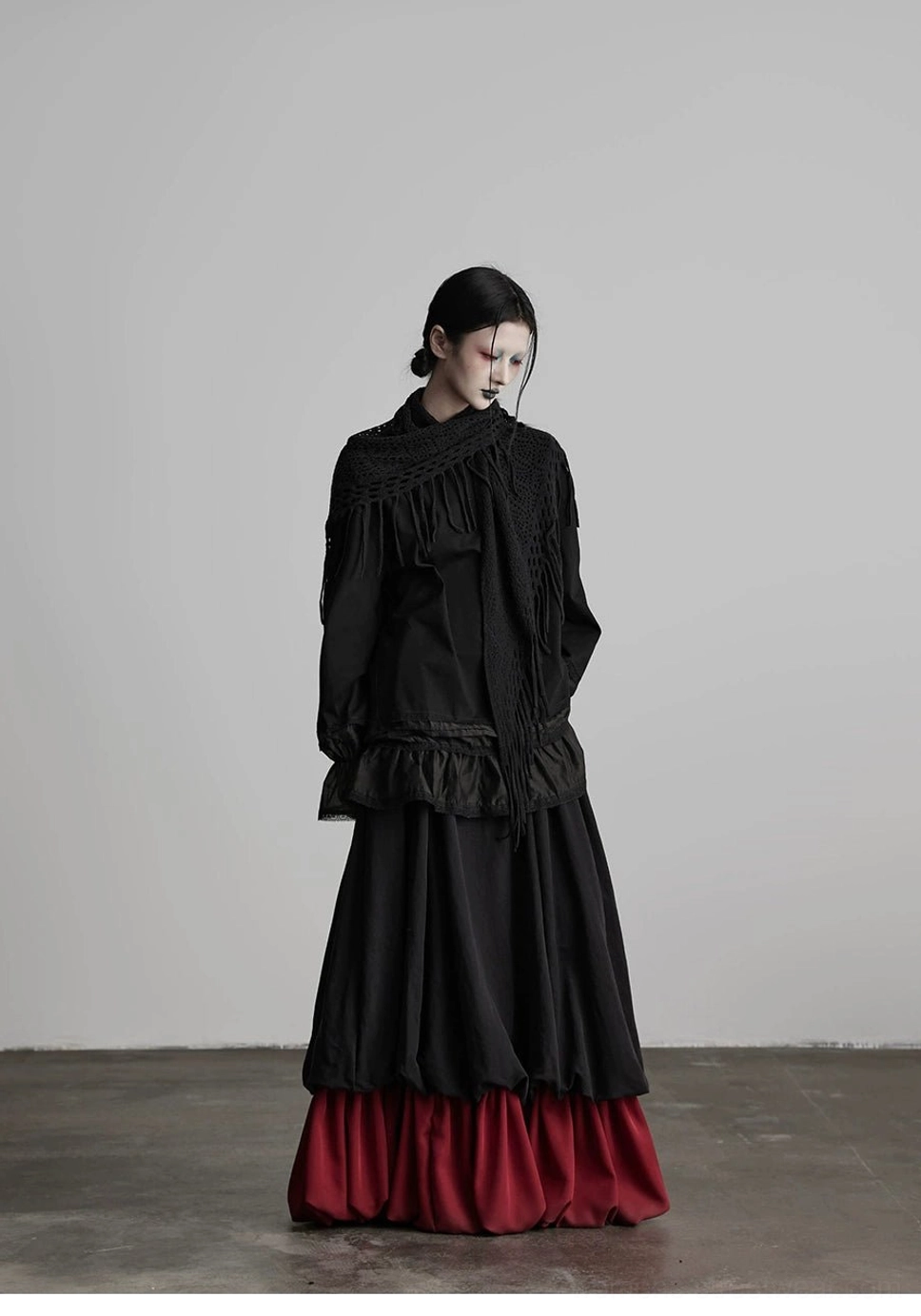 Korean fashion inspired black and wine red faux two-piece skirt for layered streetwear outfits