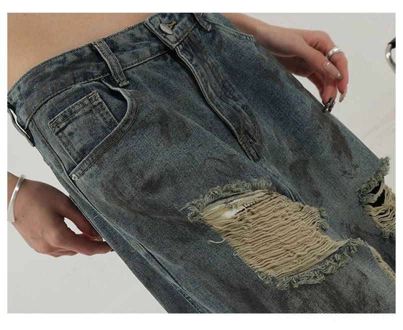 Korean fashion inspired washed blue jeans with wide legs, frayed distressing, and vintage streetwear character