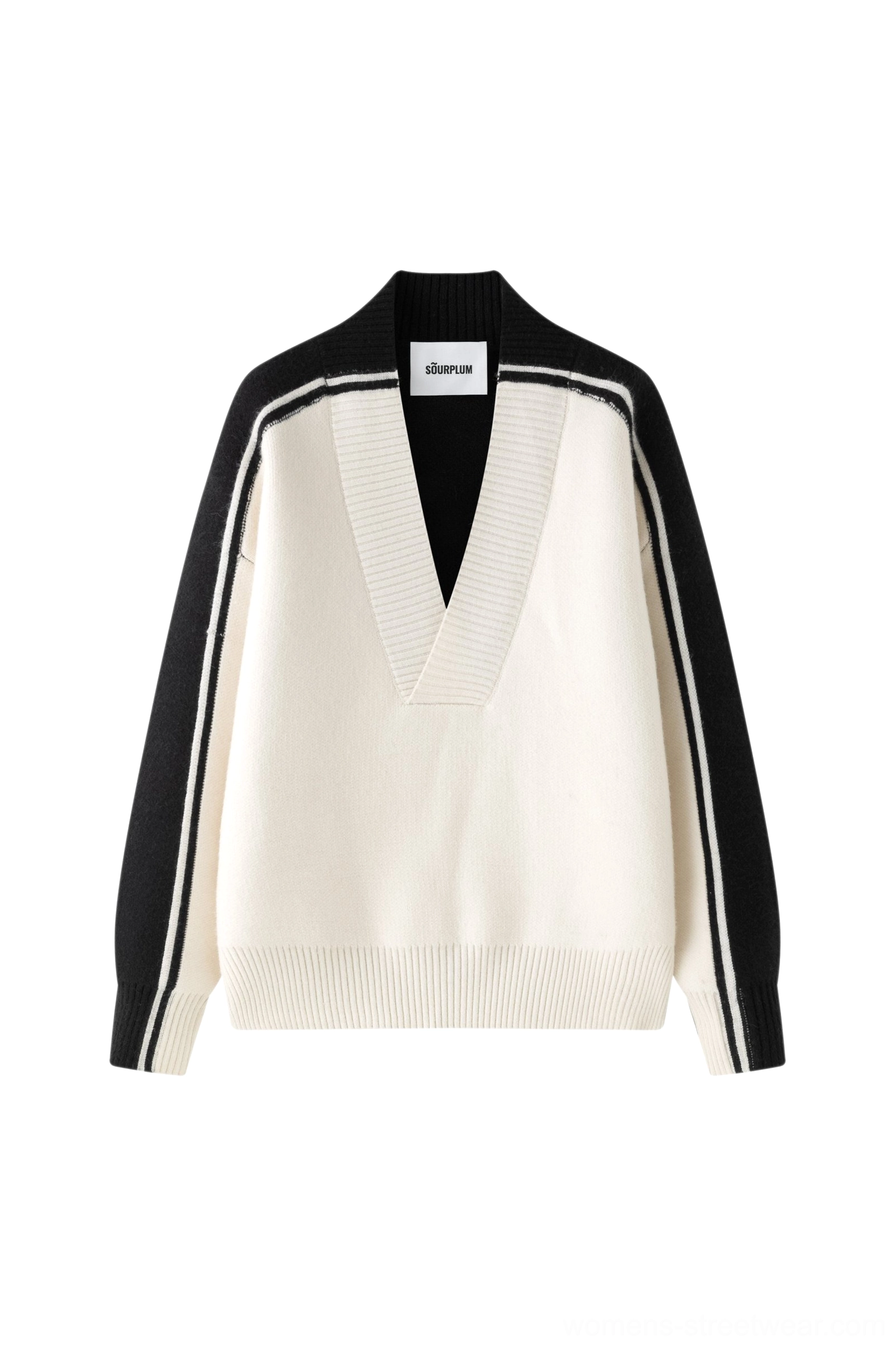 Urban style view of Korean-inspired oversized V-neck racing stripe sweater with sporty color contrast