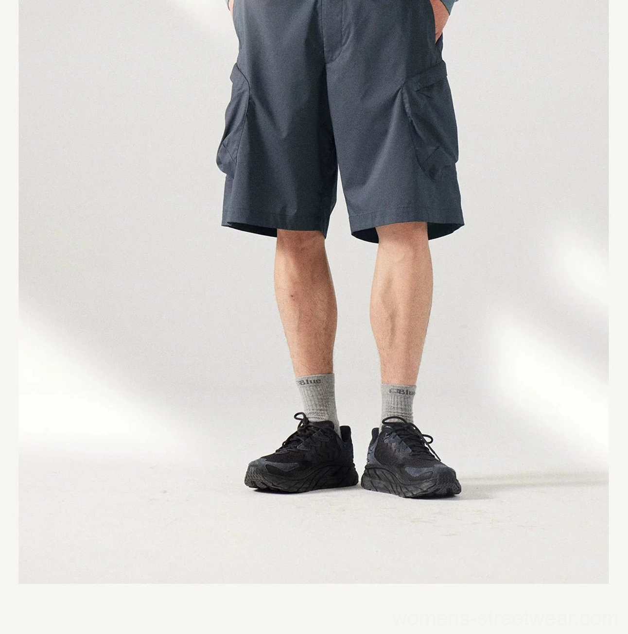 Korean-inspired relaxed cargo shorts with technical outdoor details and versatile styling for everyday outfits