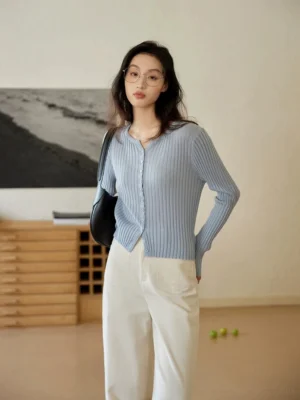 Light blue ribbed knit button-up slim fit cardigan styled with white wide-leg pants in Korean streetwear outfit