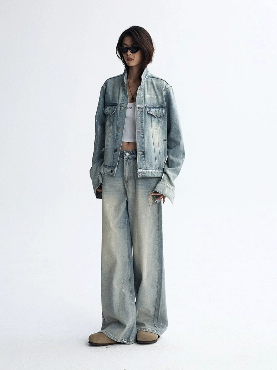 Casual Korean-inspired denim outfit with loose distressed wide-leg jeans, cropped denim jacket, and fitted crop top