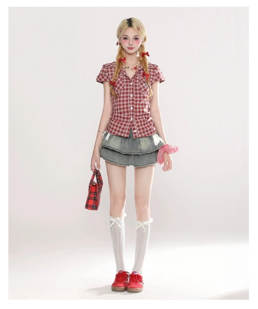 Front full-body Korean streetwear styling with a washed blue layered mini skirt, red plaid cropped blouse, white lace knee socks, red sneakers, plaid tote bag, and pink hair tie