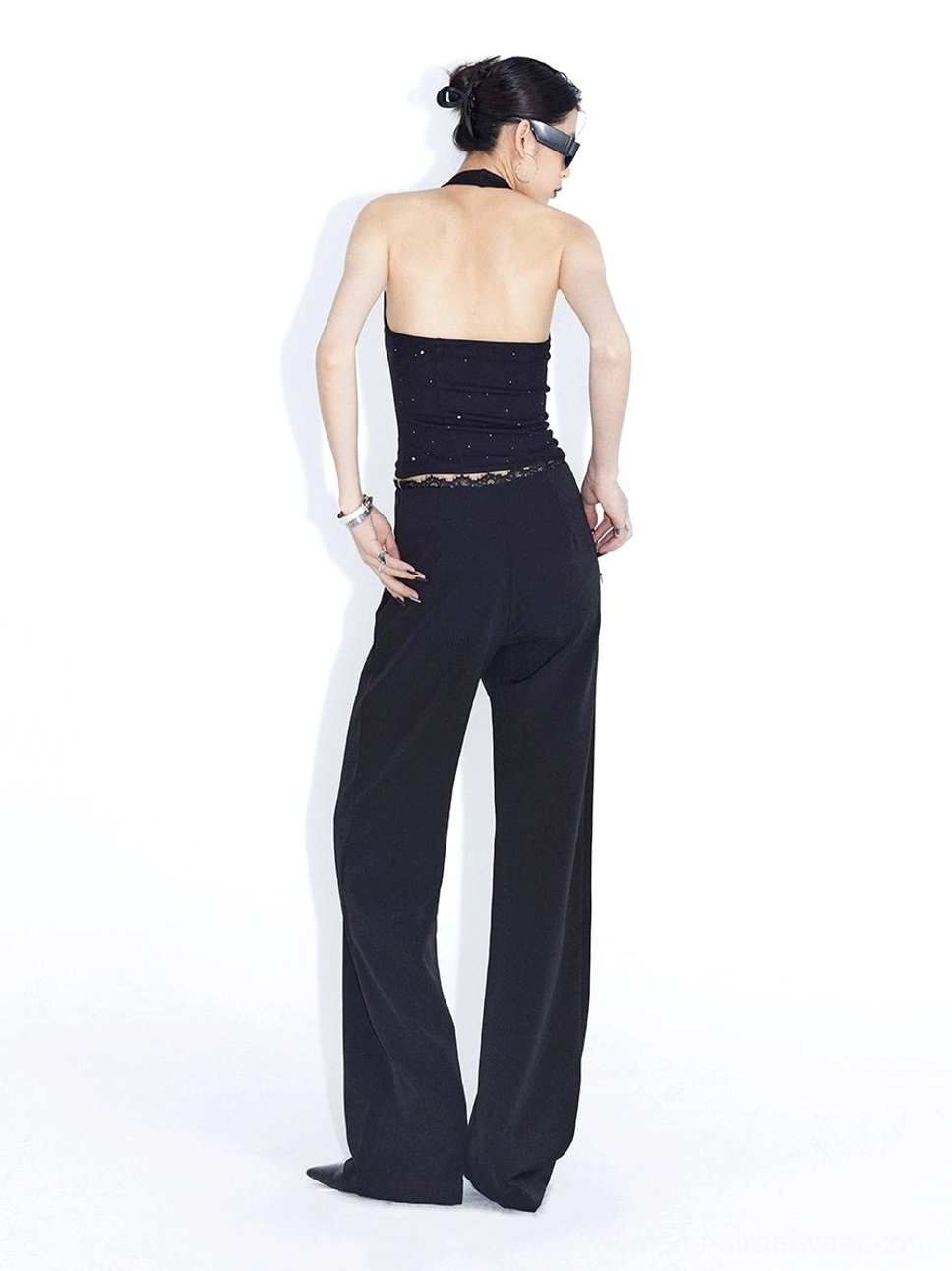 Black lace waist high-rise wide-leg streetwear trousers back full-body studio view