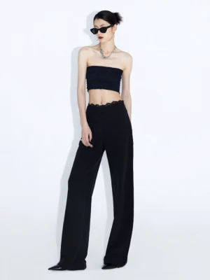 Black lace waist wide-leg streetwear trousers styled with strapless crop top and sunglasses