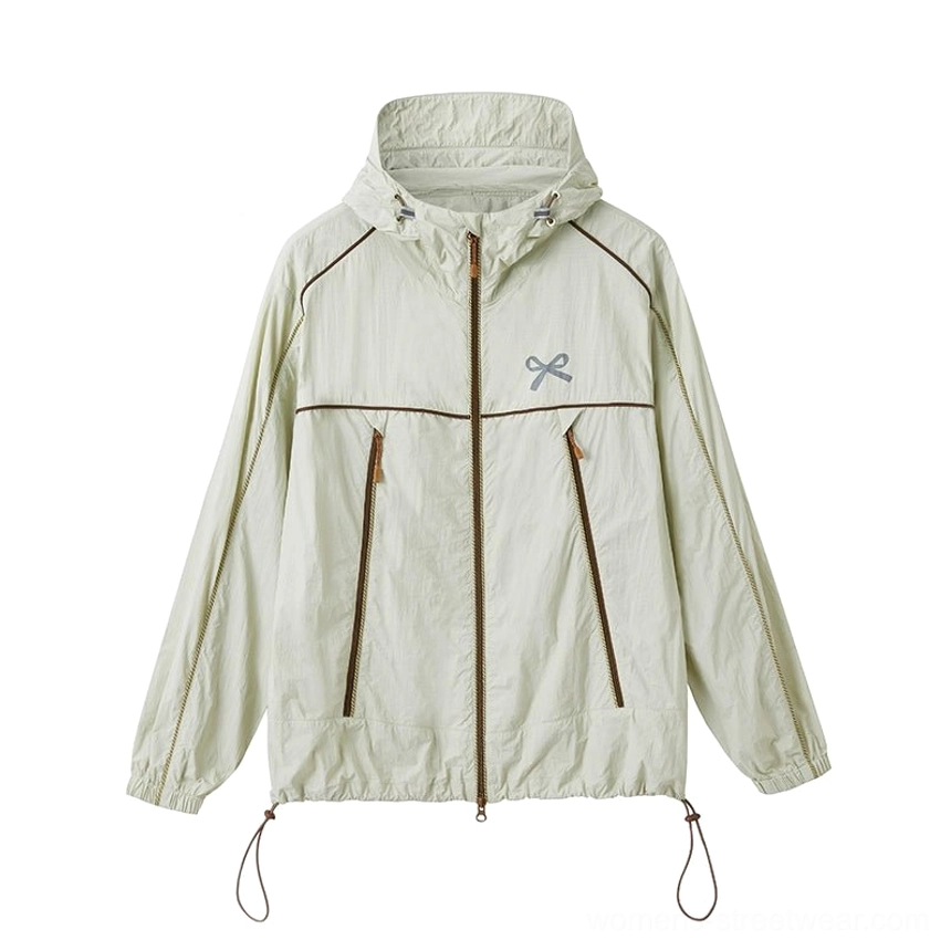 Lake green sporty hooded windbreaker jacket styled with feminine tiered lace midi skirt details for a distinctive Seoul fashion look