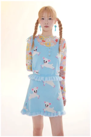 Close front view of lamb print knit camisole and mini skirt set with Henley button neckline and fuzzy ruffle trim