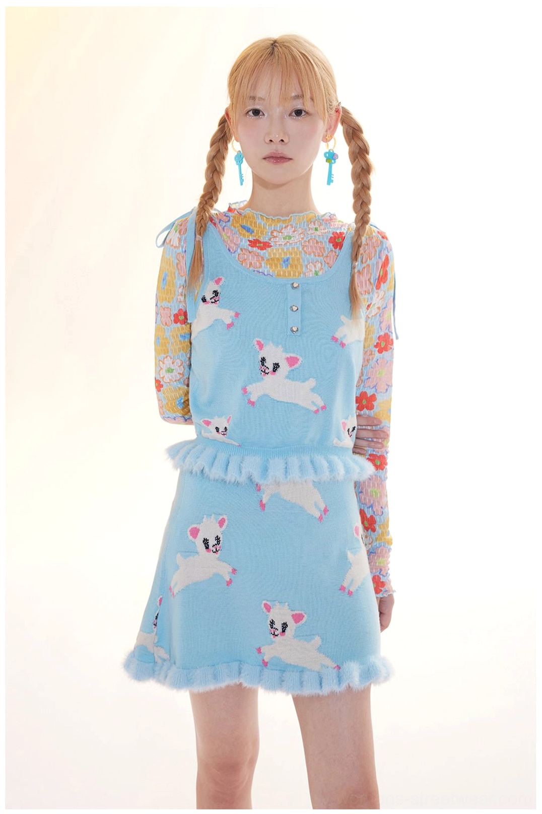 Close front view of lamb print knit camisole and mini skirt set with Henley button neckline and fuzzy ruffle trim