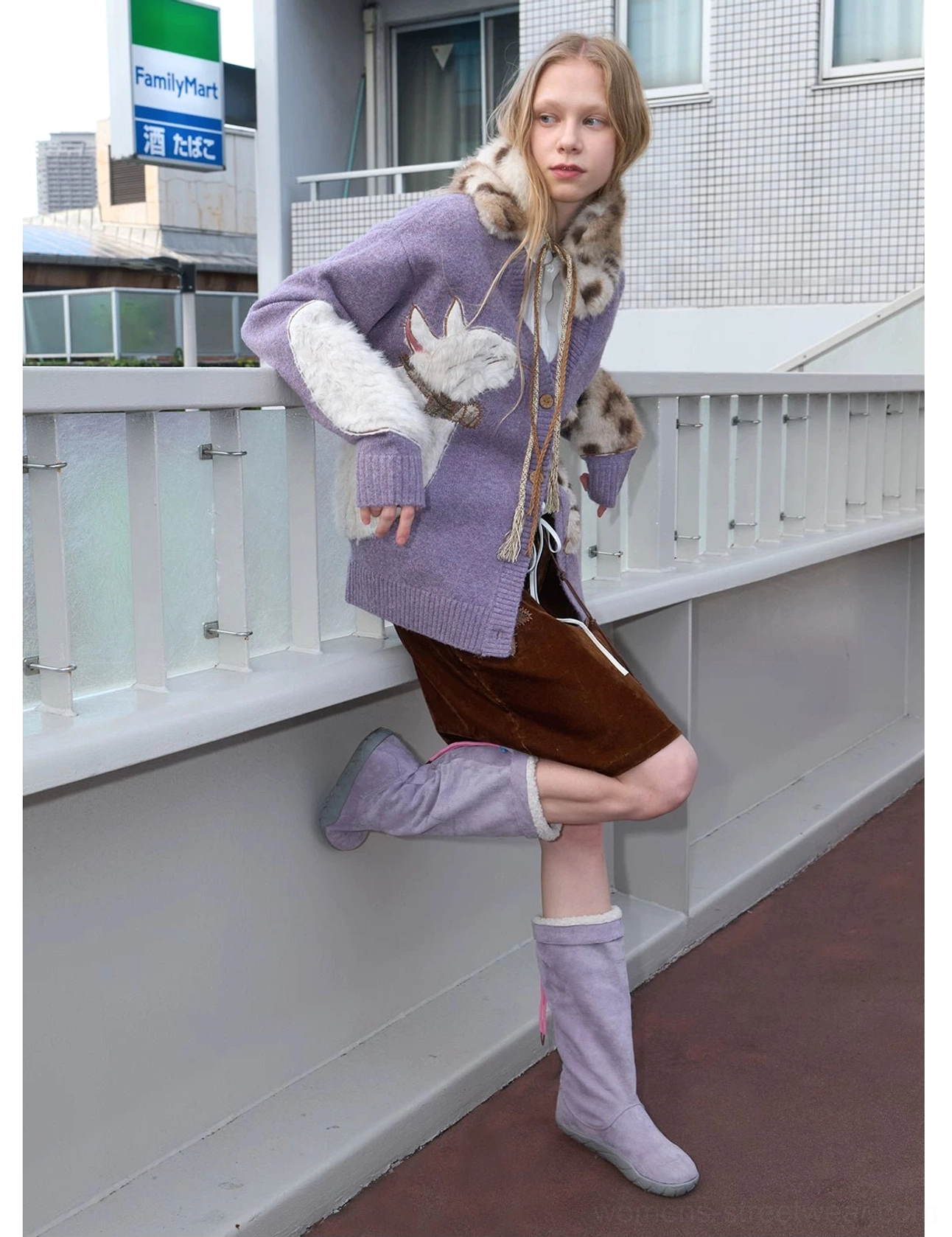 Lavender fuzzy cat cardigan side profile with relaxed fit, front pocket, plush animal details, brown mini skirt, and light purple boots