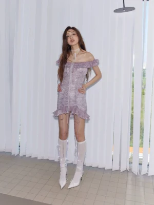 Full front view of lavender off-shoulder ruffled bodycon mini dress with ruched fabric and feminine ruffle hem
