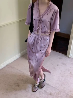 Lavender satin cropped blouse and high slit floral embroidered maxi skirt two piece streetwear set shown on a model