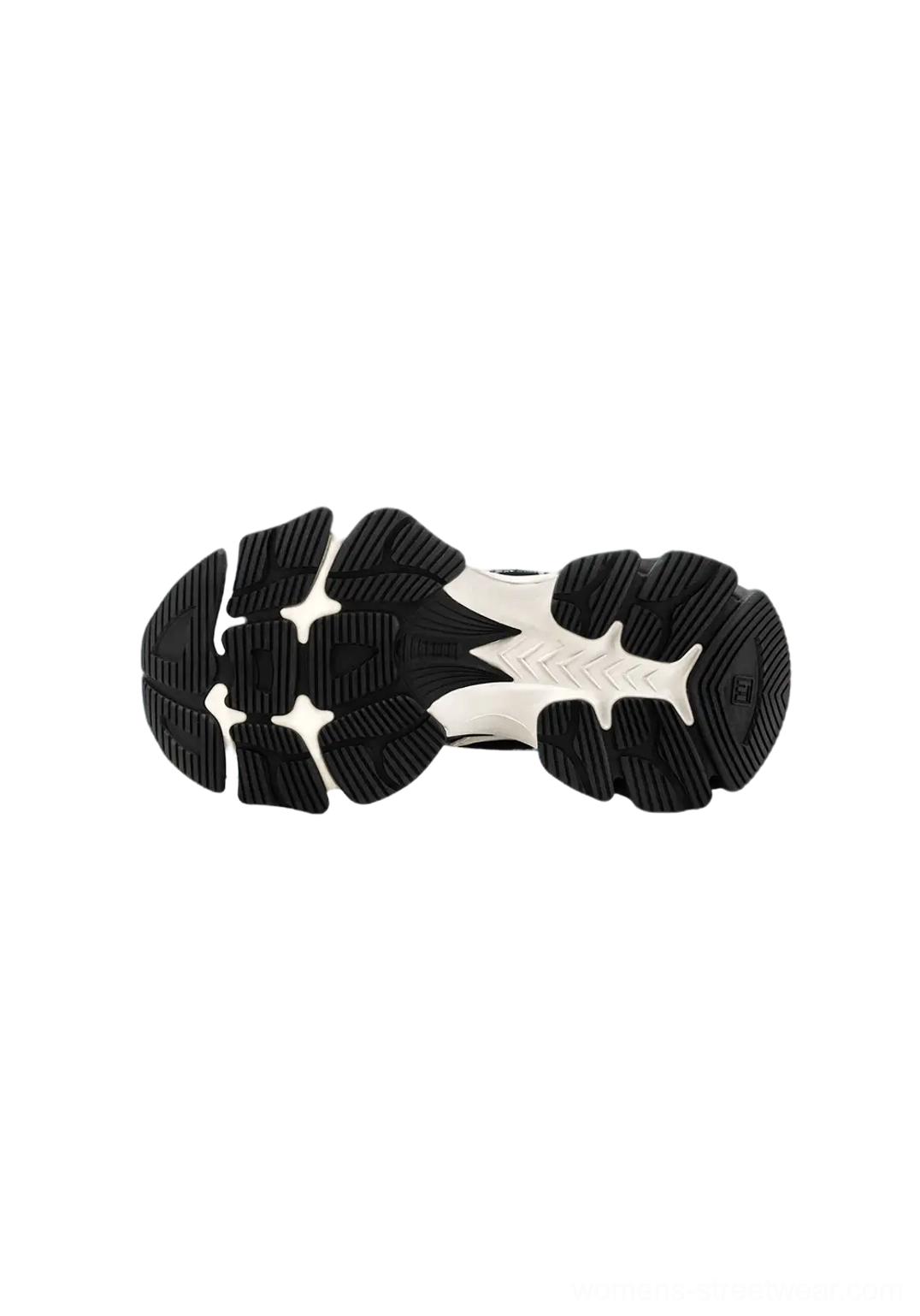 Deep grip tread outsole on black and white layered chunky dad sneakers