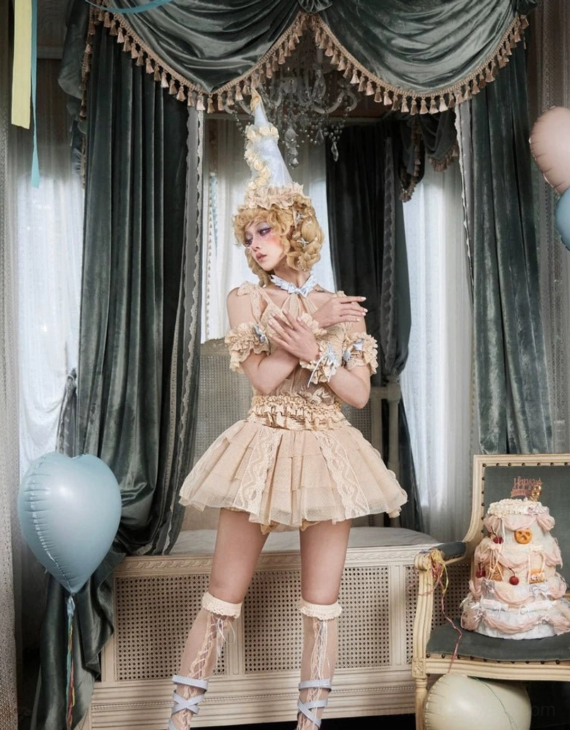 Classic layered lace tulle mini skirt outfit with ruffled hem, lace wrist cuffs, and strappy lace leg accessories