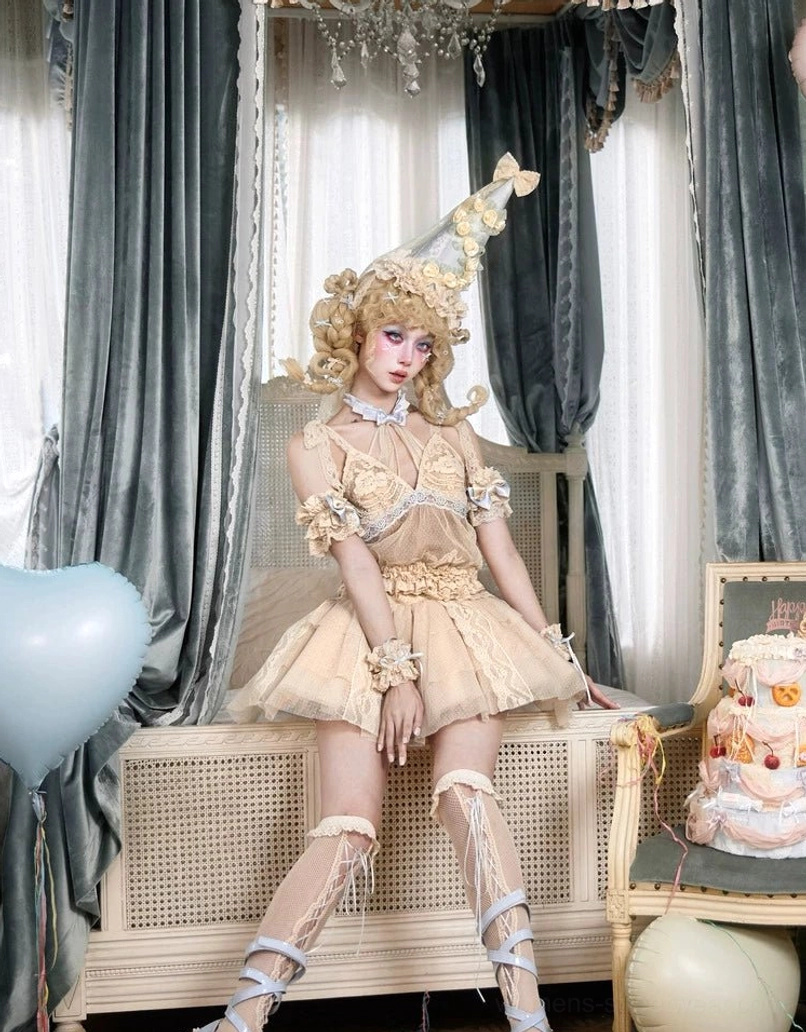 Layered lace tulle mini skirt featured in a full clown-inspired vintage lolita outfit with corset top, blue trim, and ornate party accessories