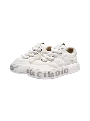 White layered leather wavy platform skate sneakers pair shown in front three-quarter view with chunky sole and thick laces