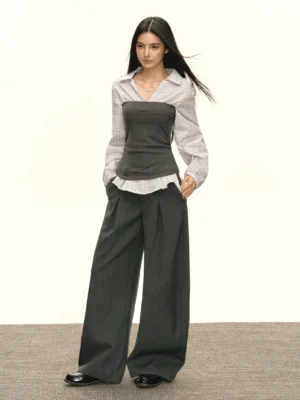 Front full-body view of a gray-white plaid layered bustier panel top with dark gray wide-leg suit trousers in Korean streetwear style