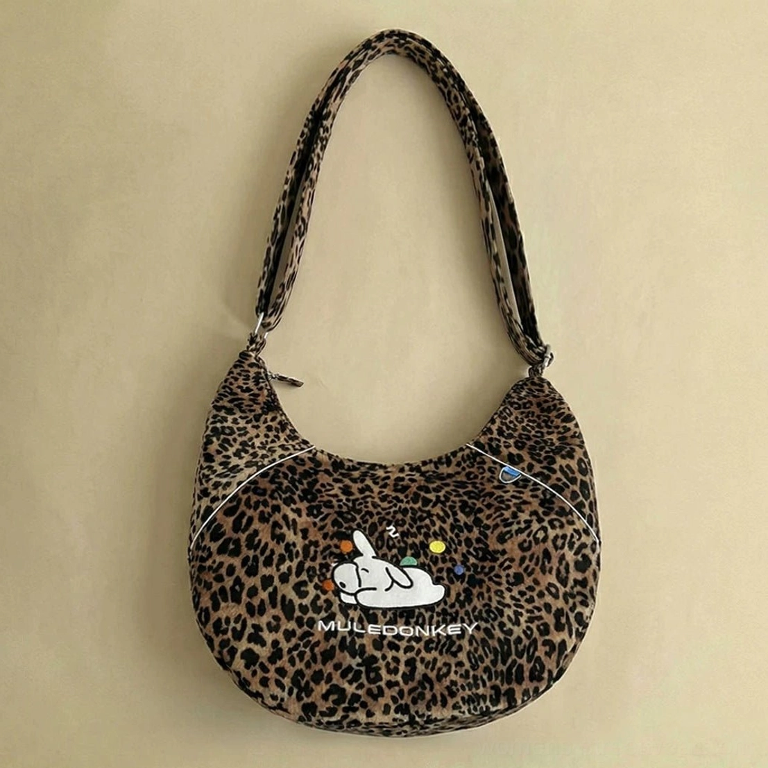 Leopard print bunny hobo shoulder bag with sleeping bunny embroidery and adjustable leopard print strap