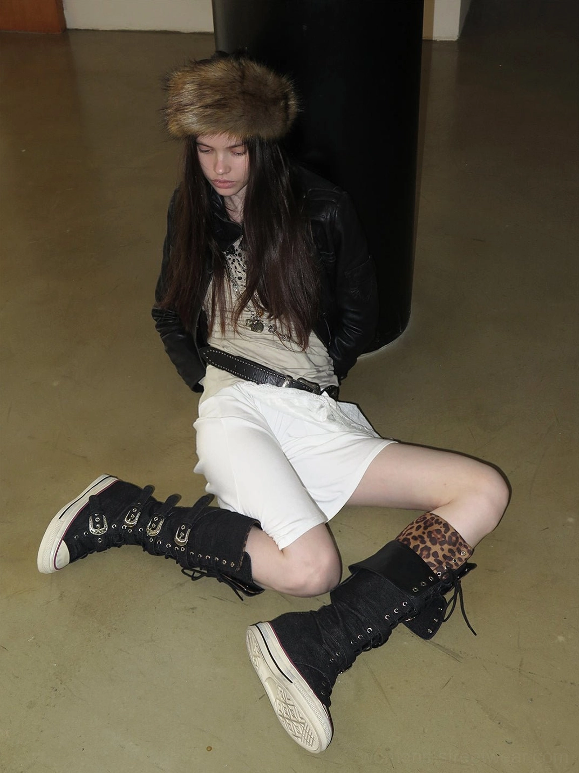 Leopard cuff knee-high canvas boots showing rear buckle straps and lace-up streetwear styling