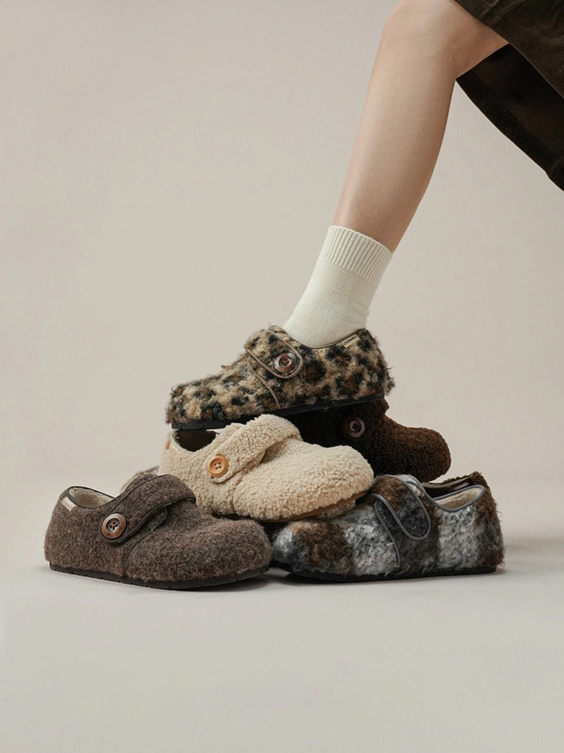 Model wearing leopard faux fur Velcro slip-on shoes in a cozy casual footwear lifestyle scene with multiple color options