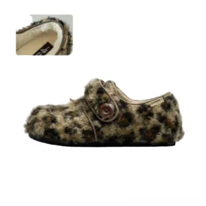Side view of leopard pattern fleece Mary Jane slippers with soft plush upper, round button fastener, closed toe, and textured heel detail