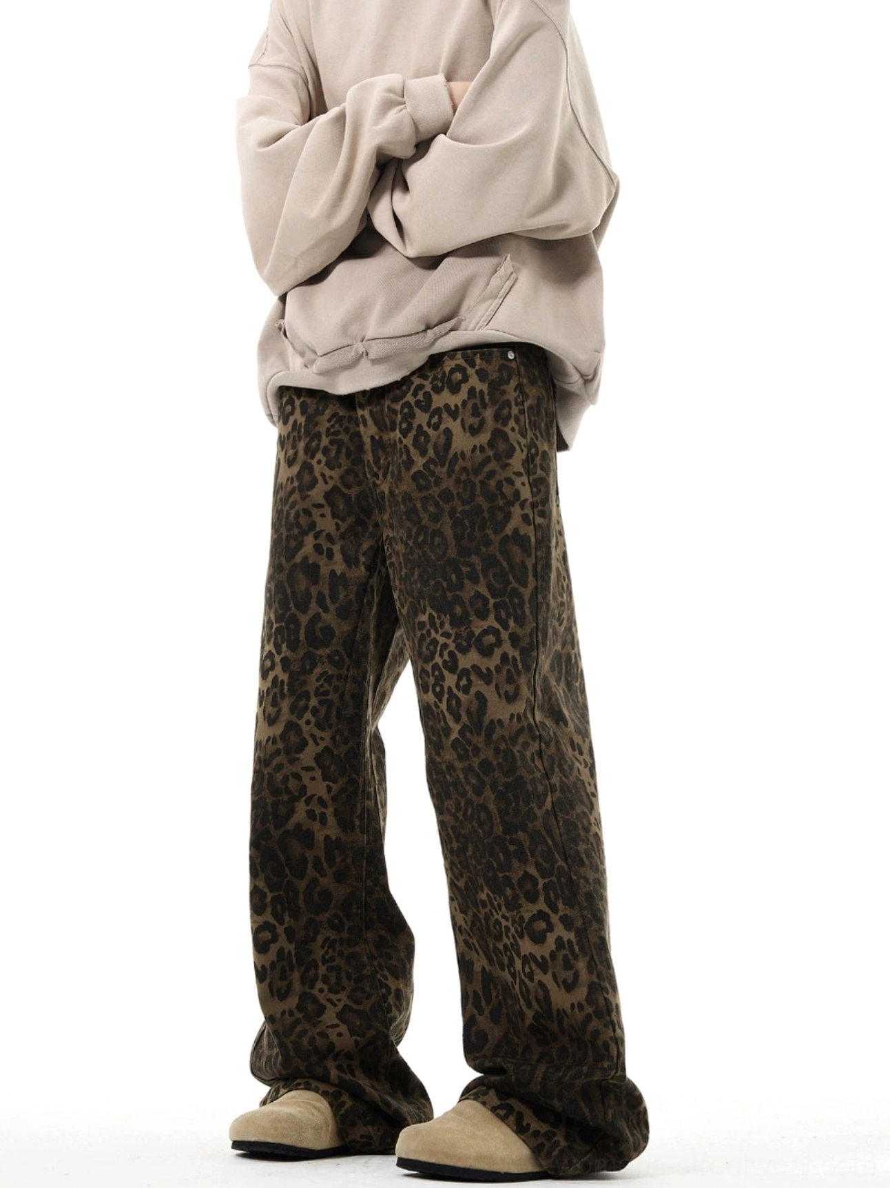Side view of leopard print full-length wide-leg streetwear pants with relaxed flowing silhouette